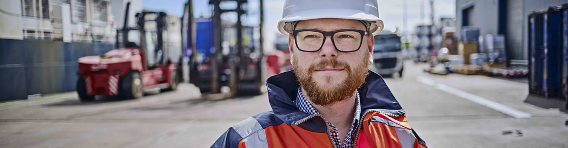Man wearing helmet and hi vis jacket
